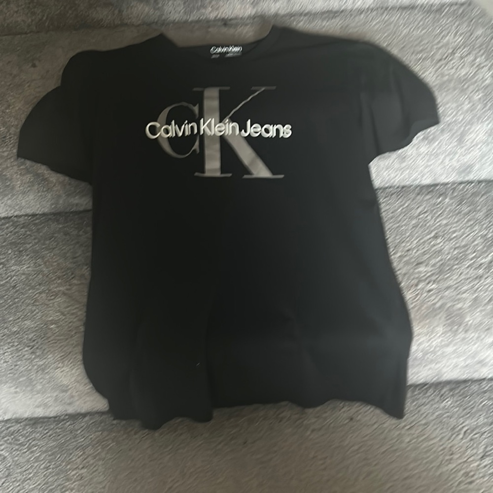 Black Calvin Klein T shirt for sale.